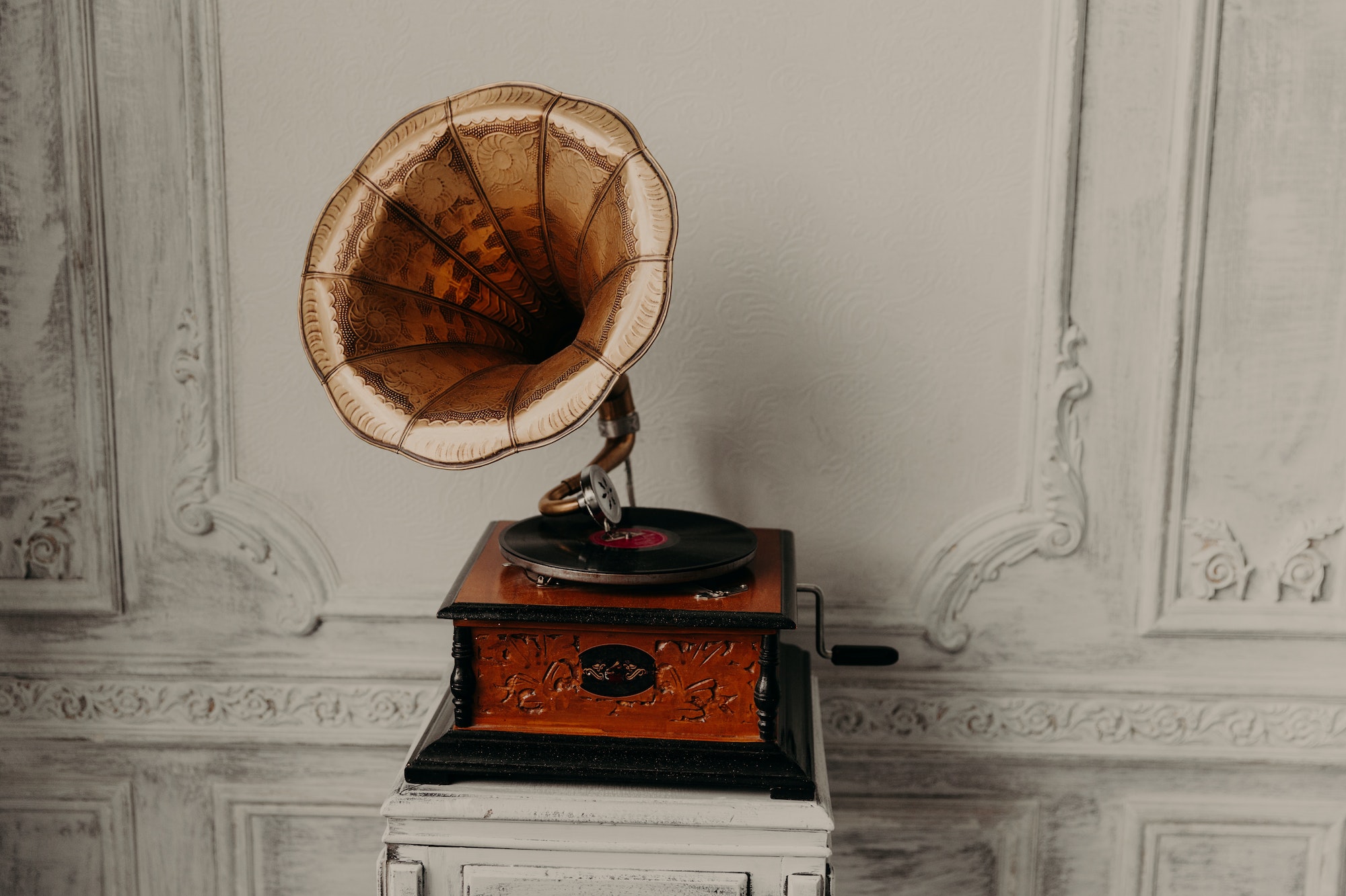 Antique gramophone with retro plate produces pleasant sounds or music